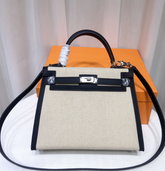 Hermes Kelly 25 Bag With Outside Stitching, Made Of Textured Canvas & Soft Swift Leather Patchwork, Classic Black Silver Hardware Combination, Stunning Mixed Material Texture Dimensions: Length 25 * Width 10 * Height 18cm