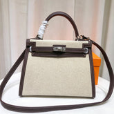 Hermes Kelly 25 Bag With Exterior Stitching Crafted Of Patchwork Canvas & Premium Swift Leather, Classic Deep Ebony Wood Shade, Unique Mixed Material Texture With Distinct Vintage Charm Dimensions: Length 25 * Width 10 * Height 18cm